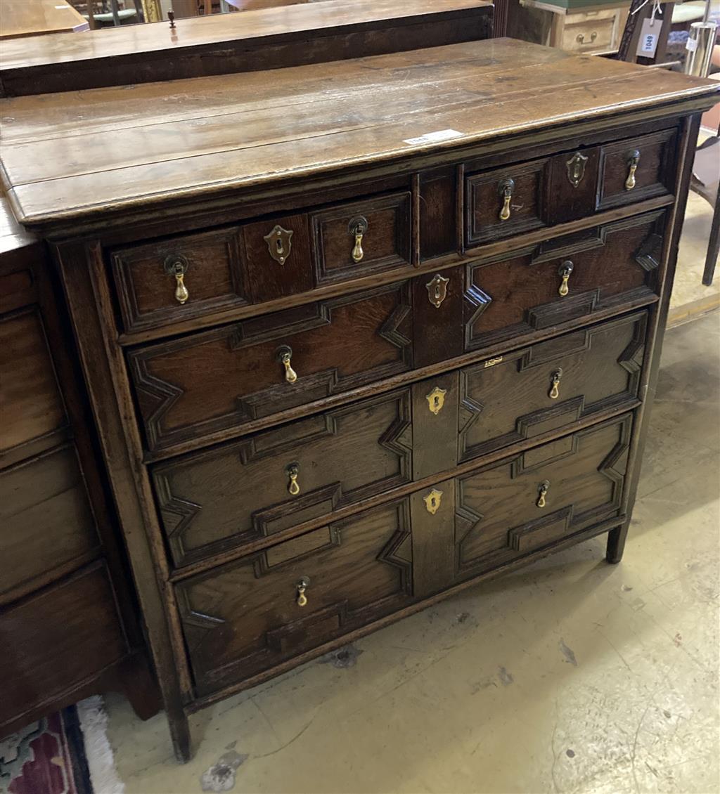 An early 18th century geometric moulded oak chest of drawers, width 96cm, depth 54cm, height 94cm